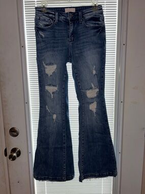 Distressed Flare Jeans in Deep Blue